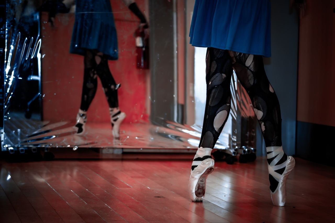 close up of person on pointe with mirror reflection