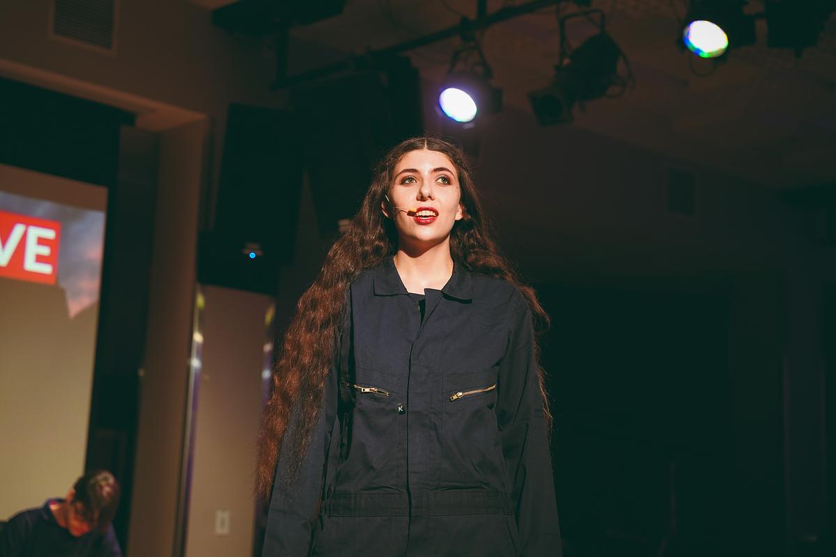 student singing on stage