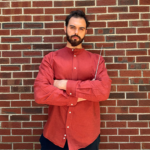 Kostantin Solopov headshot in a red shirt