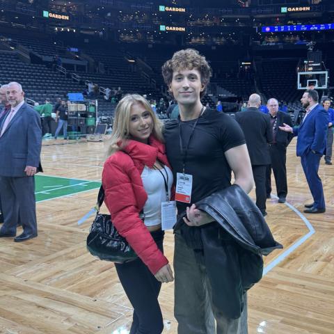 Ryan Peter Murphy and his sister Caitlin posing on the Boston Garden basketball court