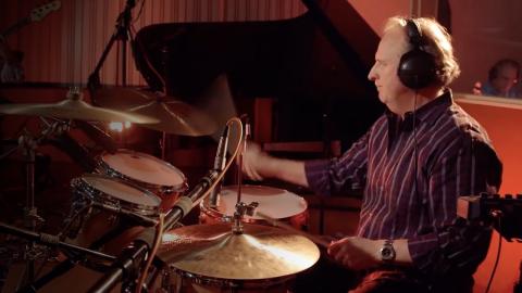 Photo of Roger playing the drums