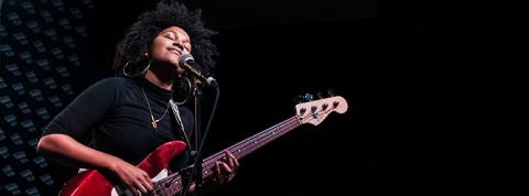 picture of a bassist/singer performing