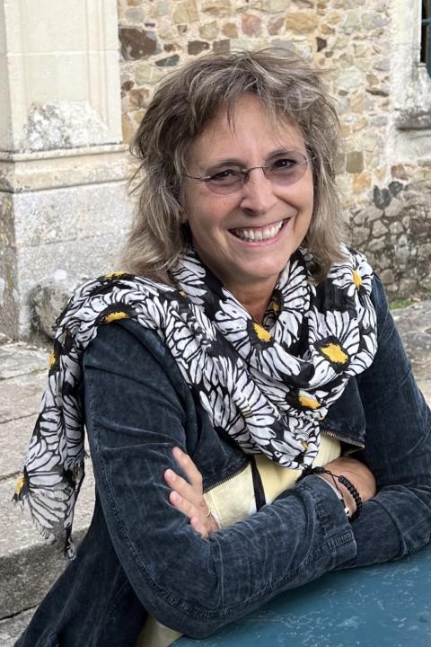 Helen Sherrah-Davies smiling with arms crossed